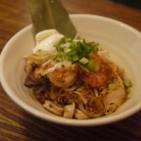 Klong Pad Thai · Glass noodle stir fried with seafood in house tamarind-paprika sauce with poached egg. 