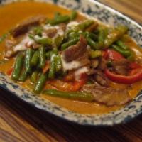 Panang Curry · Thai herbs and spices blended in mild chili paste with string beans and kaffir lime leaves s...