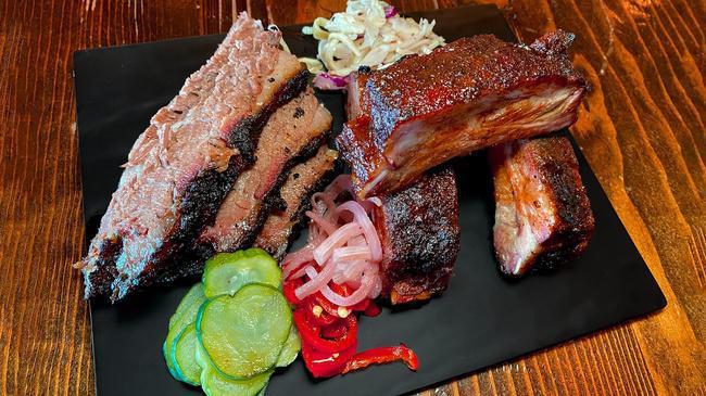 2 Meat Platter · Your choice of 2 meats with an optional assortment of pickled veggies & slaw.