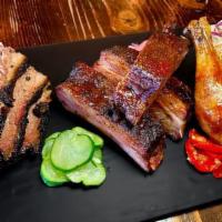 3 Meat Platter · Your choice of 3 meats, with an optional assortment of pickled veggies & slaw.