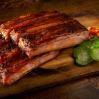 Spare Ribs · St. Louis style pork spare ribs slow-smoked for 6 hours. Served with an optional assortment ...