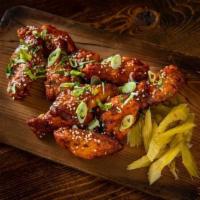 Spicy Wings · Slow-smoked for 2 hours before being flash-fried and tossed in our house-made Chile-Lime Sau...