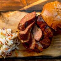 Brisket Sausage · Made with all naturally raised beef and freshly ground spices. Served with an optional assor...