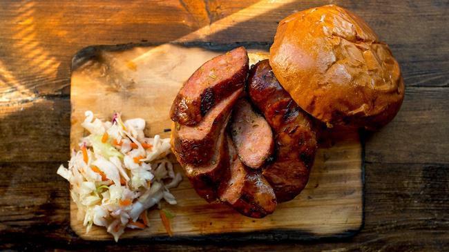 Brisket Sausage · Made with all naturally raised beef and freshly ground spices. Served with an optional assortment of pickled veggies & slaw.