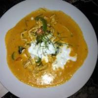 17. Panang Curry · Panang curry paste cooked with coconut milk, bell peppers and basil.
( recommend ordering ri...