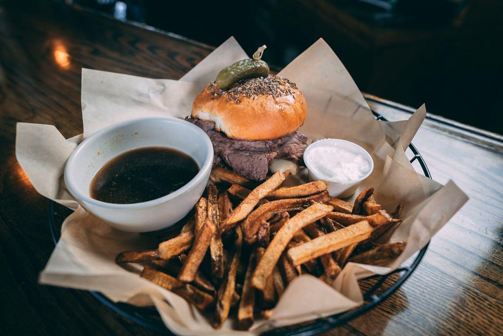 Beef on Weck Sandwich · House made roast beef and provolone on a salted Kimmelweck or plain brioche roll. Comes with a side of au jus and horsey mayo.