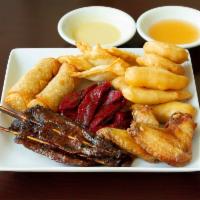 20. Pu Pu Platter · 2 pieces fried shrimp, 2 pieces egg rolls, 4 pieces beef teriyaki, 2 chicken wings, 8 bonele...