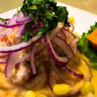 Ceviche de Pescado · Pieces of fish (seabass or mahi-mahi) marinated with fresh lime juice red onions topping sid...