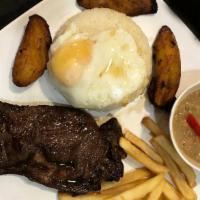 Pobre Steak · Grill rib-eye 9 oz. steak with beans, egg, crispy fries, fried plantain bananas and side of ...