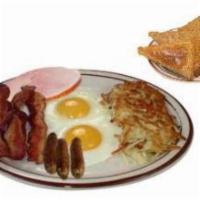 Country-Style Breakfast · Two eggs, hashbrowns, bacon, ham, and sausage links for the hearty appetite.
