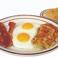 All-American Breakfast · Two eggs, golden hashbrowns, and your choice of bacon, ham, or sausage (patties or links).