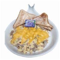 Meat Lover's Skillet · Scrambled eggs loaded with ham, bacon, sausage, green peppers, onions, over hashbrowns, and ...