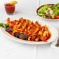 *Zuppa Di Mare · Baby lobster, shrimp, calamari, scallops, and clams in thin tomato sauce.