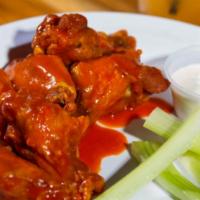 Chicken Wings · Served with choice of sauce.