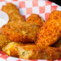 Jalapeno Poppers · 6 jalapenos filled with cheddar cheese served with ranch.