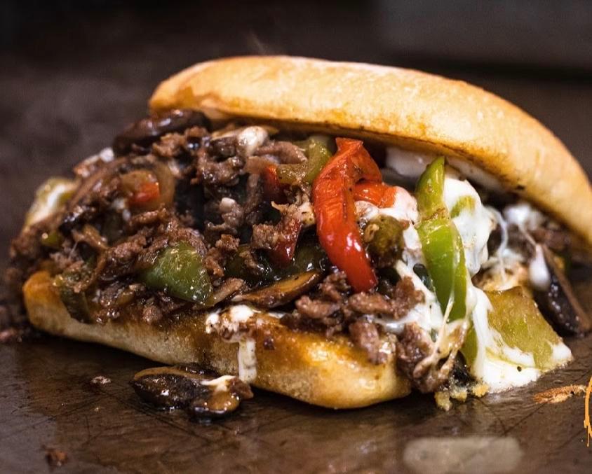 Steak Bomb Sandwich · Sliced sirloin beef, topped with sauteed onions, peppers, mushrooms and melted provolone. Served on a ciabatta roll.