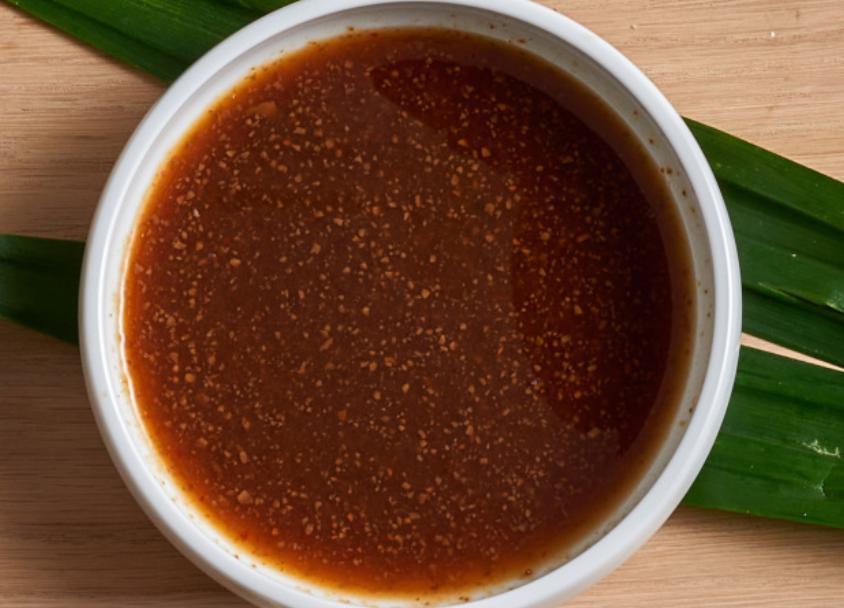 Extra KMG Sauce · Signature Nong's sauce. (Fermented soy bean, soy sauce, ginger, hand peel garlic, Thai chili, Thai vinegar).
