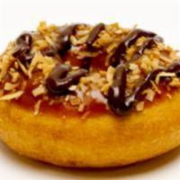Caramel Delight Donut · Caramel Icing, topped with toasted coconut and finished with a chocolate drizzle.