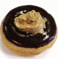 Buckeye Donut · Chocolate icing, topped with peanut butter and covered in chocolate icing.