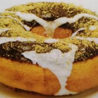 S'more Donut · Chocolate icing, topped with Graham cracker crumbs and a marshmallow drizzle.