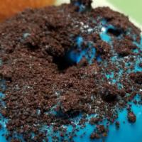 Cookie Monster Donut · Blue icing, topped with Oreo crumbs.