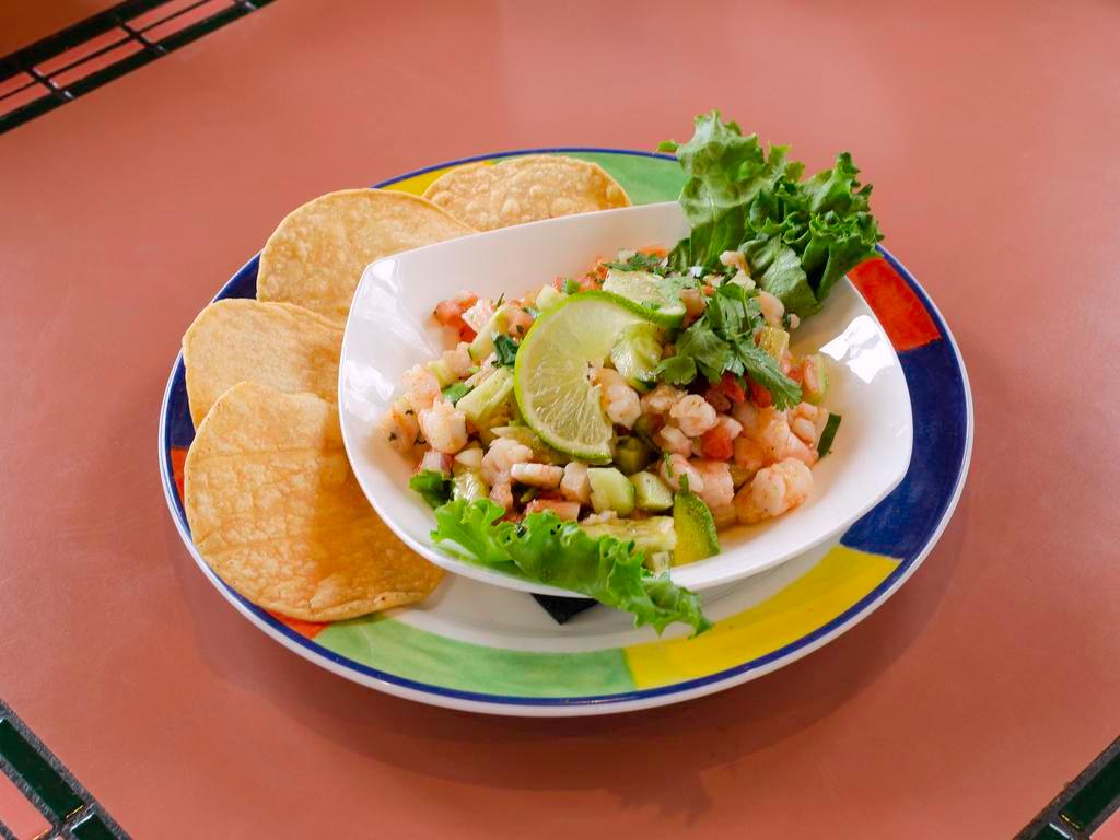Ceviche · Prawns in lime juice, onions, tomatoes, jalapenos, cilantro, garlic, salt and black pepper. Served with 3 tostaditas.