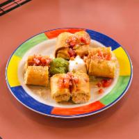 Chicken Taquitos · 2 rolled flour tortillas stuffed with chicken and Jack cheese, served crispy. Garnished with...
