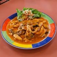 Arroz con Pollo · Boneless breast of chicken sauteed in a light tomato sauce with mushrooms and onions, served...