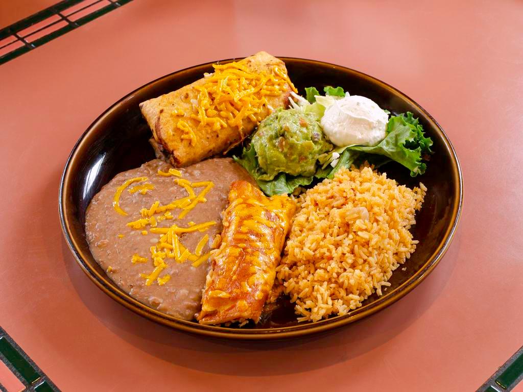 Grande #1 Combo · Choice of 2 enchiladas, tacos, tostadas, tamales or any combination of two. Served with black, refried or rancho beans and Mexican or white rice.