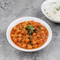 Chana Batura · Large fluffy bread made with refined flour and served with chickpeas.