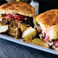  Tortas · Mexican sandwich with fried beans, melted chesse, tomatoe, onion, mayonnaise, avocado and pr...