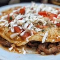 Sincronizada · 2 flour tortillas with melted cheese, protein to chose and onion, tomato, white cheese, sour...