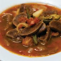 Mexican Style Tongue (Lengua a la mexicana) · Onion, chile serrano and red tomatoes and potatoe, rice and beans.