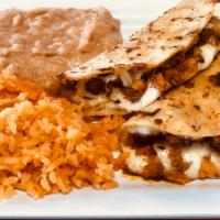 2 Quesadillas Special · Corn tortillas with melted chesse and potato with chorizo inside with rice and beans. Add be...