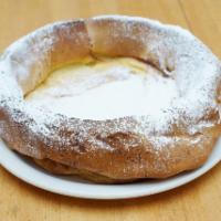 German Pancake · Dusted with powdered sugar and served with fresh lemon on the side.