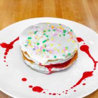 Birthday Cakes · confetti sprinkle pancake batter layered with cherry compote topped with cream cheese frosti...