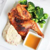 Roasted Half Chicken · Oven-roasted and seasoned half chicken served with chicken jus.   A choice of two sides.