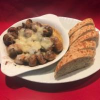 French Onion Mushroom · 1/2 a pound of button mushroom simmered in a red wine garlic sauce and baked with a crispy g...