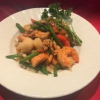 Whiskey Seafood Medley Dinner · Pan-sauteed salmon, scallops, and shrimp served with house vegetables and candied walnuts on...