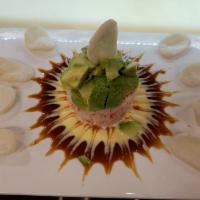 Crab Tower  · No rice. Comprised layers of crabmeat and avocado topped with mango sauce and eel sauce serv...