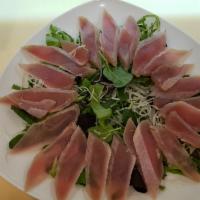 Tuna Tataki  · Lightly seared tuna served thinly sliced with ponzu sauce.