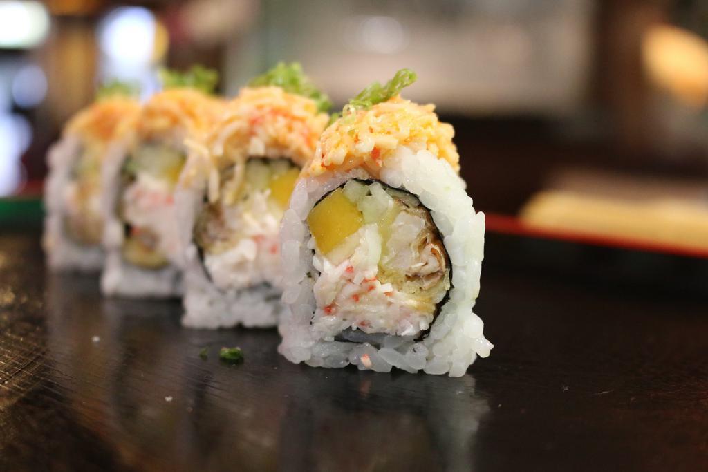 Amazing Spider Roll · Mango, soft shell crab, crab meat, cucumber, avocado topped with spicy crab meat and yuzu sauce and scallions.