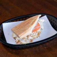 Chicken Sandwich · Roasted chicken topped with tomatoes, onions, cheese, and mayo.
