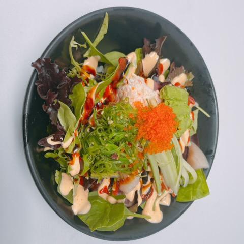 Mixed Poke Bowl · Tuna, salmon, hamachi, real crab, avocado, cucumber, seaweed salad, tobiko, sushi rice, and spring mix.
