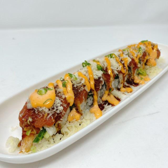 Mowry Roll · In: tempura shrimp, cucumber. Top: spicy tuna, crunch, tobiko, and green onion with eel sauce. Hot and spicy.
