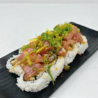 Kiseki Poki Roll · In: real crab, avocado. Out: tuna poki, seaweed salad with tobiko.