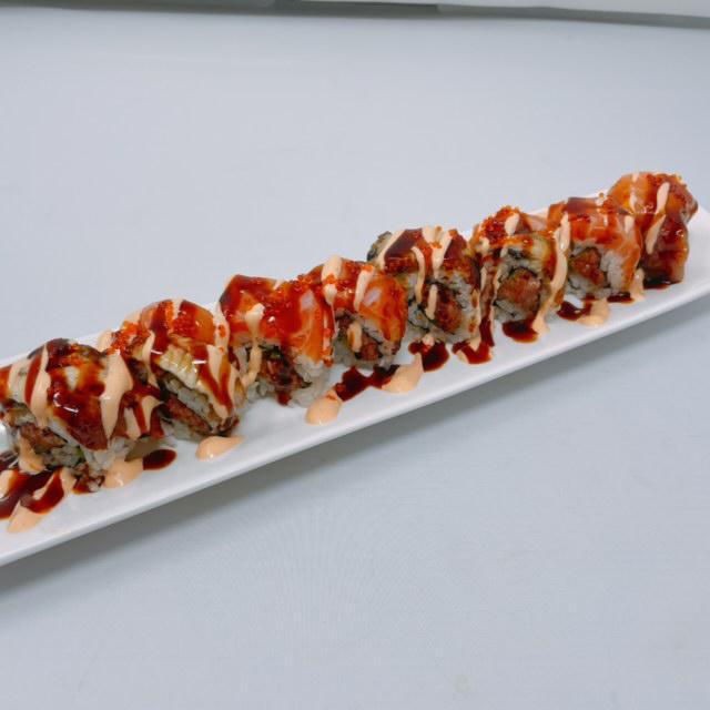 Caliente Roll · In: spicy tuna, jalapeno, and unagi. Top: salmon, unagi, and tobiko with special sauce. Hot and spicy.