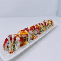 Mango Paradise Roll · In: cooked shrimp, cucumber, and avocado. Out tuna, mango, and tobiko and special sauce.