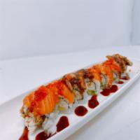 SF Giant Roll · In: real crab and avocado. Out: salmon, unagi, eel sauce, and tobiko. Hot and spicy.