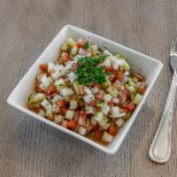 Shirazi Salad · Chopped cucumber, tomato, onions, seasoned with lemon juice dressing.